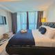 BGC Cozy Condo - Balcony, Pool, Wi-Fi - Suite 34, Manila - Fotografie 2