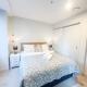 Stylish 2BR City Retreat with Cityscape Views, Pool & Gym, Окленд - Фото 6