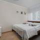 Red Apartment in Wrocław with Two Bedrooms and Desk for Remote Work by Noclegi Renters, Bartoszowice (фото 2)