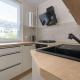 Red Apartment in Wrocław with Two Bedrooms and Desk for Remote Work by Noclegi Renters, Bartoszowice (фото 10)