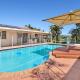 Relaxing 4BR Robina Escape with Parking & Pool