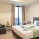 Spacious and Homey Studio at Cleon Park Apartment By Travelio