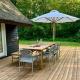 Be Surrounded By Trees In A Thatched Cottage