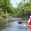 a person in a kayak on a river