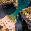 an aerial view of a beach with a group of people