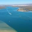 an aerial view of two boats in the water
