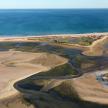 an aerial view of the ocean and a beach