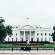 a man sitting in front of the white house