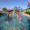 a water slide in a pool at a resort