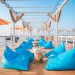 a deck on a cruise ship with blue pillows