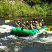 a group of people in a raft on a river