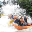 a group of people in a raft on a river