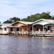 a row of houses on a dock on the water