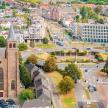 an aerial view of a city with a church