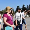 a group of people standing in a parking lot
