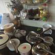 a kitchen counter with pots and pans and utensils