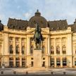 a large building with a statue in front of it