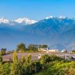 a parking lot with a view of mountains and a lake