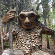 a statue of a person in the woods