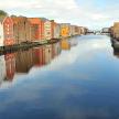 a view of a river with colorful buildings and houses
