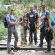a group of people standing on a bridge