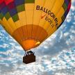 a colorful hot air balloon flying in the sky
