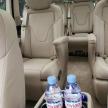 two bottles of water sitting in the back seats of a car