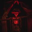 a skeleton with a red light on