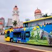 a double decker bus parked in front of a building