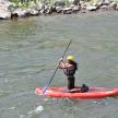 a woman on a paddle board in the water
