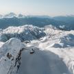 an aerial view of a snow covered mountain range