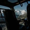 a view of a snow covered mountain from a helicopter