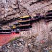 a building on the side of a mountain