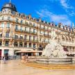 a building with a fountain in front of a building