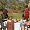 a group of people sitting at a table eating food