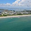 an aerial view of a beach and a city