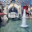 a fountain in the middle of a amusement park