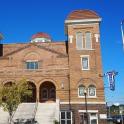 a large brick building with two domes on top