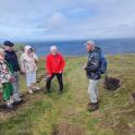 a group of people standing on top of a hill