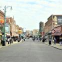 a city street with people walking down the street