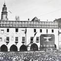 an old photo of a crowd in front of a building