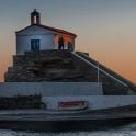 a man standing on top of a lighthouse
