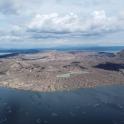 an aerial view of an island in the water