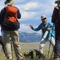 a group of people standing on top of a mountain