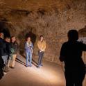 a group of people standing in a tunnel