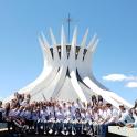 a group of people posing in front of a building