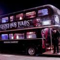 a double decker bus on the street at night