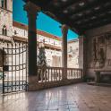 an ornate gate in a building with a fireplace