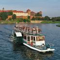 a group of people on a boat on a river
