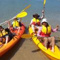 a group of people in kayaks on the water